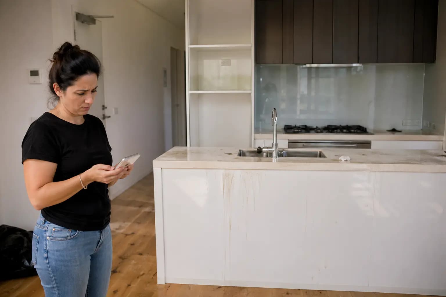 Cleaner performing detailed end-of-lease cleaning to avoid costly re-cleans